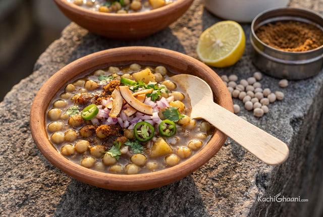 Ghugni, plump soft white peas and small potato cubes in a thin dark brown gravy