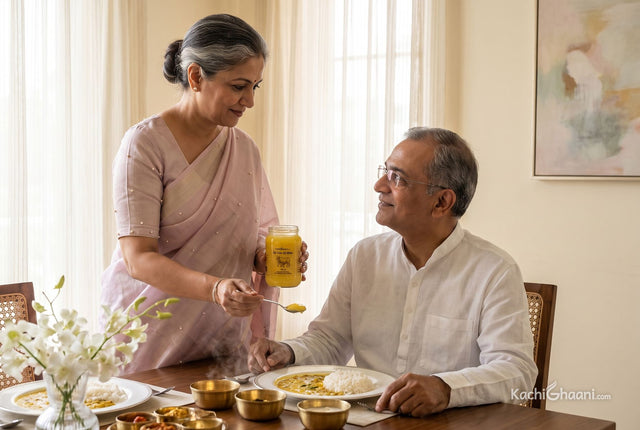 Is ghee healthy? An Indian woman adds one measured teaspoon of A2 ghee to her husband's dal and rice at a family lunch