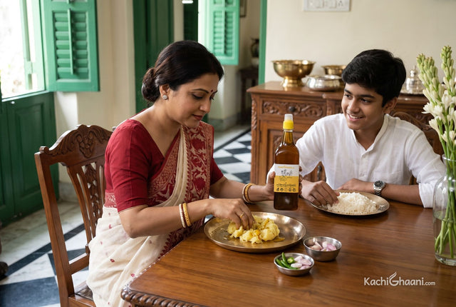 Bengali mother mixing aloo bhorta with raw mustard oil at a heritage Kolkata table, one of the classic mustard oil uses