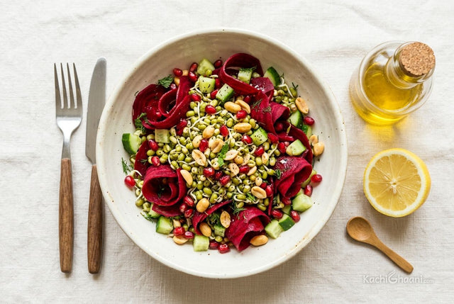 Beetroot and sprouted moong salad in a ceramic bowl with a small bottle of flaxseed oil