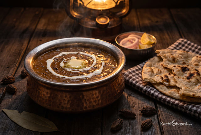 Dal Makhani, near-black glossy lentil curry, thick enough to hold ladle marks