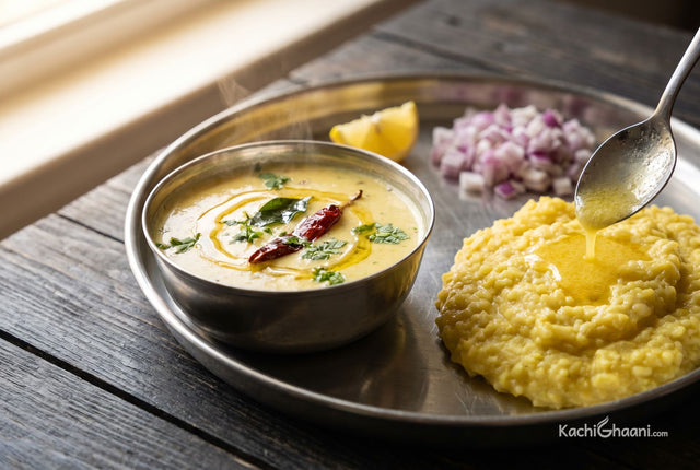 Gujarati Kadhi, a pale golden thin yogurt curry in a small steel katori, steam rising