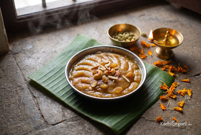 Sooji ka Halwa, glossy deep golden semolina halwa holding soft ridges from the spoon, ghee glistening at the edges