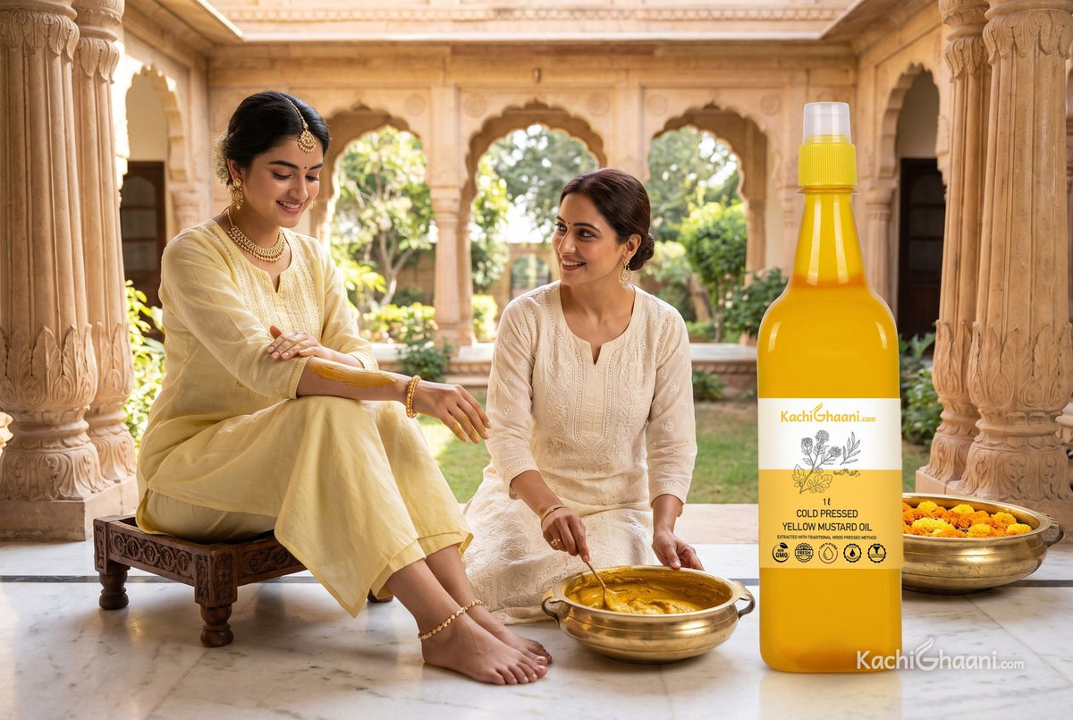 Bride-to-be rubbing turmeric ubtan along her arm in a haveli courtyard as a relative stirs more paste in a brass bowl beside yellow mustard oil