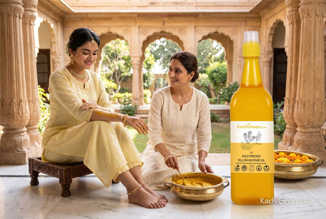 Bride-to-be rubbing turmeric ubtan along her arm in a haveli courtyard as a relative stirs more paste in a brass bowl beside yellow mustard oil